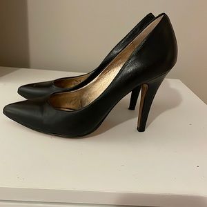 BCBGeneration size 6 black leather pumps.